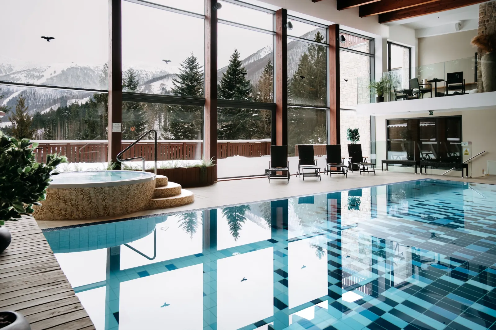 Indoor pool with winter mountain view